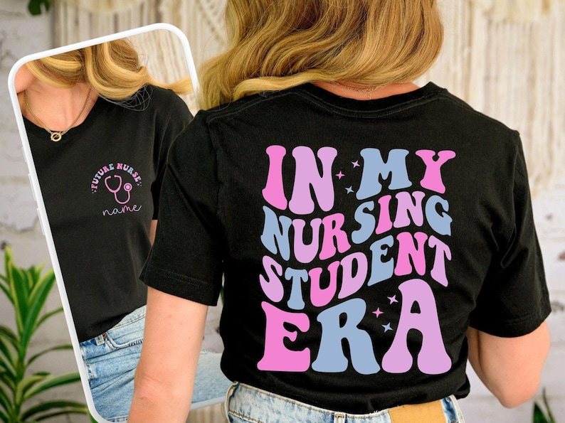 May include: Black t-shirt with the text "IN MY NURSING STUDENT ERA" in pink and blue retro font. The front of the shirt has the text "FUTURE NURSE" with a stethoscope graphic. A stylish tee for nursing students.