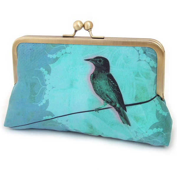 Bolso de mano de seda con forma de pájaro en un cable y asa de cadena opcional.