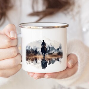 Woman holding a Cowboy enamel camp cup with a colorful Western design