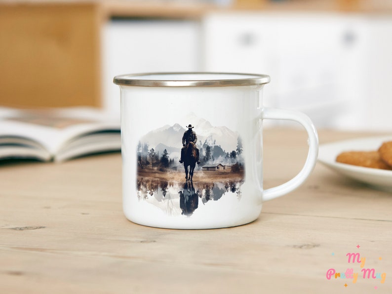Cowboy camp coffee cup with a Western print, displayed on a wooden table