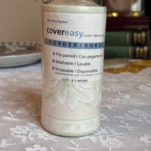 May include: A roll of Graham & Brown covereasy border wallpaper. The label reads "covereasy color textures BORDER/BORDE". The wallpaper is pre-pasted, washable, and strippable. Dimensions are 15 ft. by 5 inches.