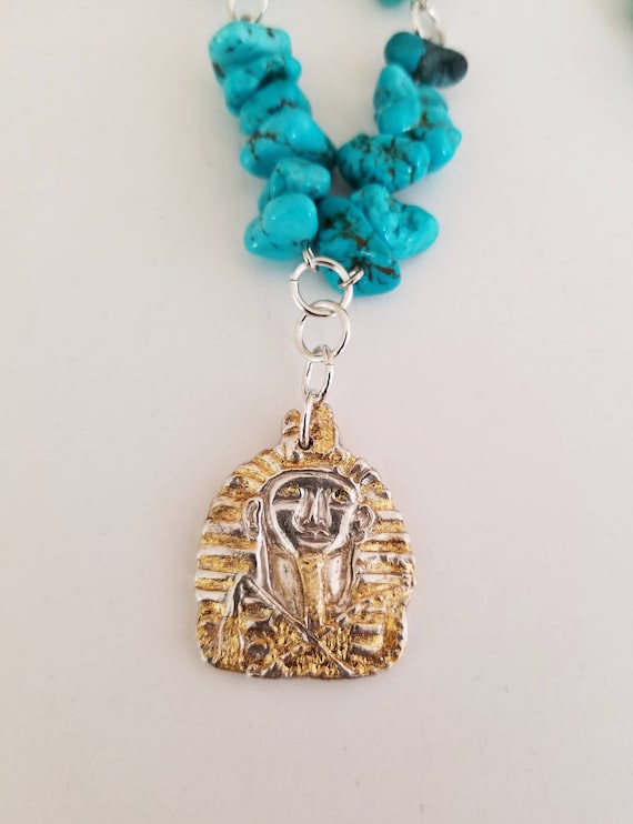 Pendant/Necklace Fine Silver and Gold Leaf on Turquoise Nuggets/Chain 22 Inches. Pendant 29mm x 23mm x 3mm, Turquoise Nuggets 6mm to 11mm.