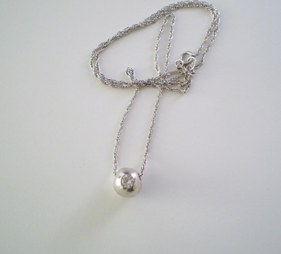 Necklace Fine Silver .999 Bead with a Cubic Zirconia Floats Freely on an 18 inch Sterling Silver Chain.