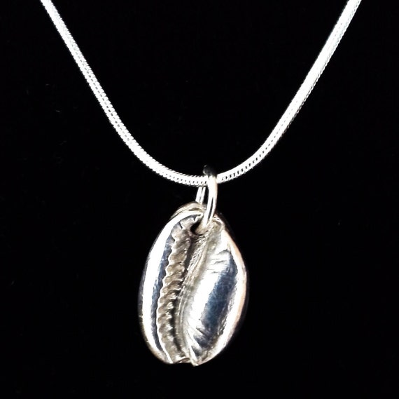 Silver Necklace Cowry Shell Pendant 17mm x 11mm x 6mm The Handcrafted Pendant (JxJ)Jewelry by Jennell is on a 16-inch Sterling Silver Chain.