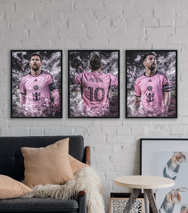 May include: Three framed prints of a soccer player wearing a pink jersey with the number 10 and the name "Messi" on the back. The player is surrounded by a white and gray abstract design.