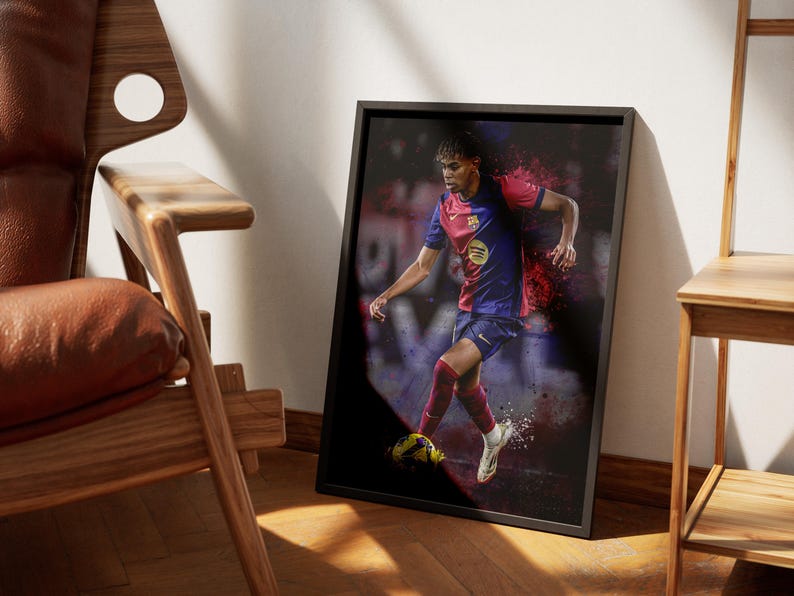 May include: A framed print of a soccer player in a red and blue jersey dribbling a soccer ball. The player is in mid-stride with a determined expression on their face. The background is a blurred image of a soccer field.