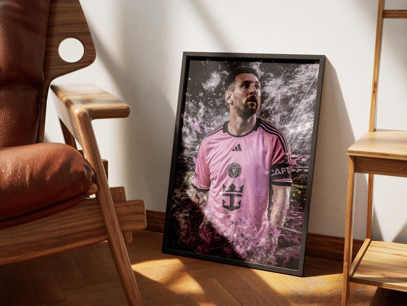 May include: A pink soccer jersey with black accents and the text "CAPT" on the sleeve. The jersey has a white crown and a ship's anchor logo. The player is wearing a black armband.
