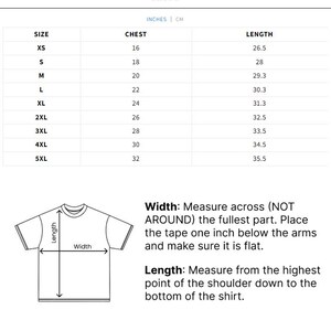 May include: A white size chart with measurements in inches and centimeters for t-shirts. The chart includes sizes XS to 5XL, chest measurements from 16 to 32 inches, and lengths from 26.5 to 35.5 inches. A diagram illustrates how to measure width and length.