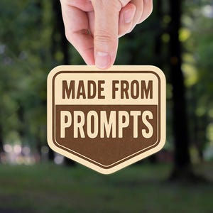 May include: A tan and brown sign with the words "MADE FROM PROMPTS" in a bold font is held up against a blurred green forest background. The sign has a unique shield shape with a decorative border.