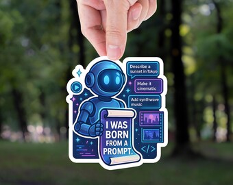 May include: A sticker featuring a blue robot holding a scroll that reads "I WAS BORN FROM A PROMPT." The sticker also includes text boxes with prompts like "Describe a sunset in Tokyo" and "Make it cinematic."