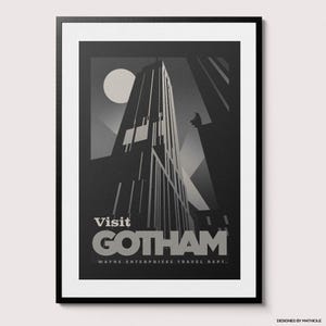 May include: Framed art print featuring a stylized, grayscale depiction of a skyscraper under a full moon. The poster reads "Visit Gotham" with "Wayne Enterprises Travel Dept." below. A dark silhouette of a figure is perched on a building.