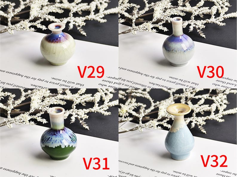 May include: Four miniature ceramic vases labeled V29, V30, V31, and V32. V29 is round with blue and cream glaze. V30 is a tall-necked blue and white vase. V31 features green, blue, and white tones. V32 is a light blue vase with a wide rim.