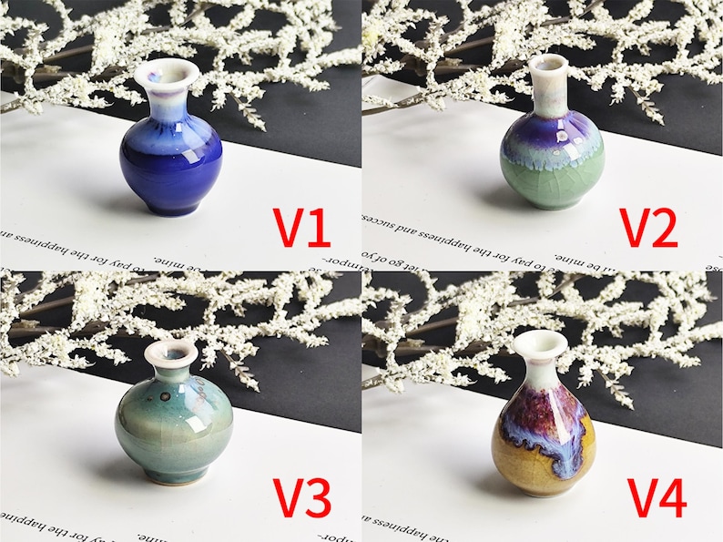 May include: Four miniature ceramic vases labeled V1, V2, V3, and V4. V1 is deep blue, V2 is green and purple, V3 is light teal, and V4 features a yellow, purple, and blue glaze. Each vase has a rounded body, a narrow neck, and a flared rim.