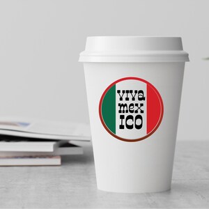 May include: White to-go coffee cup with a red, white, and green circle sticker that says "Viva Mexico" in black text.