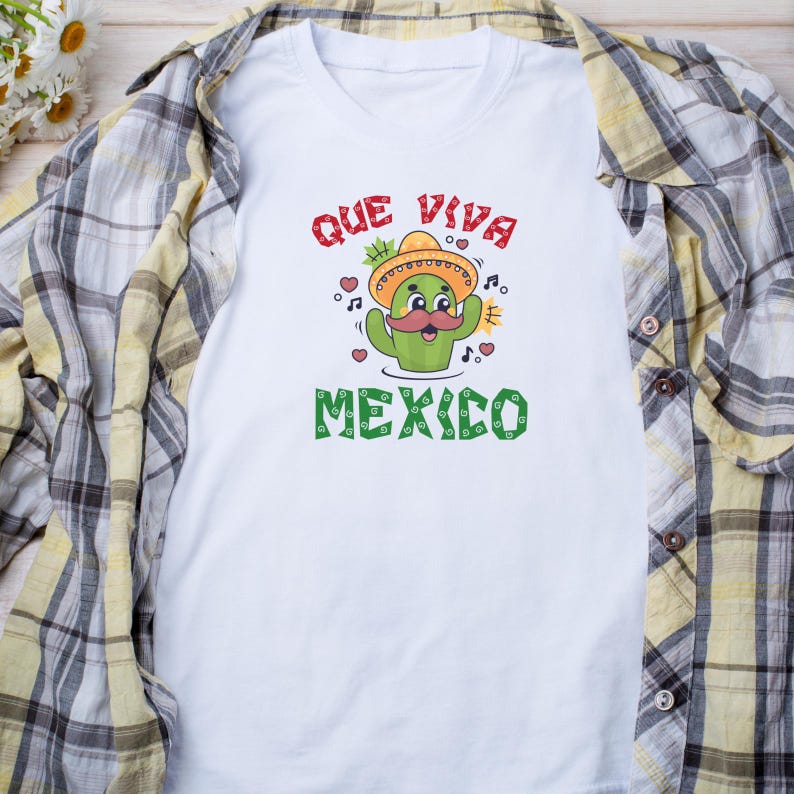 May include: White t-shirt with a green cactus wearing a sombrero and a mustache. The text "Que Viva Mexico" is printed on the shirt.