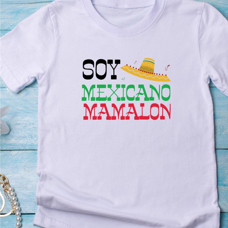 May include: White t-shirt with black, green, and red text that reads "Soy Mexicano Mamalon" and a yellow sombrero graphic.