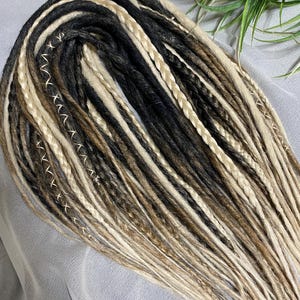 Short grey-white dreadlocks, salt and pepper. Double sided dreadlocks in Viking style!