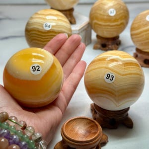 Banded Orange Calcite Sphere & Stand (Natural Crystal)