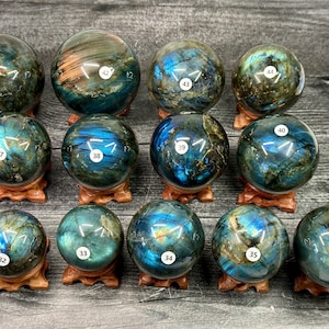 May include: A set of three ceramic mugs with a speckled, matte finish. The mugs are in shades of cream, light gray, and dark gray. Each mug has a simple, minimalist design, perfect for coffee or tea.