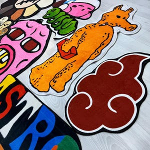 May include: A set of colorful cartoon-style rugs featuring various characters and designs. The rugs are made of soft, plush material and are perfect for adding a playful touch to any room.