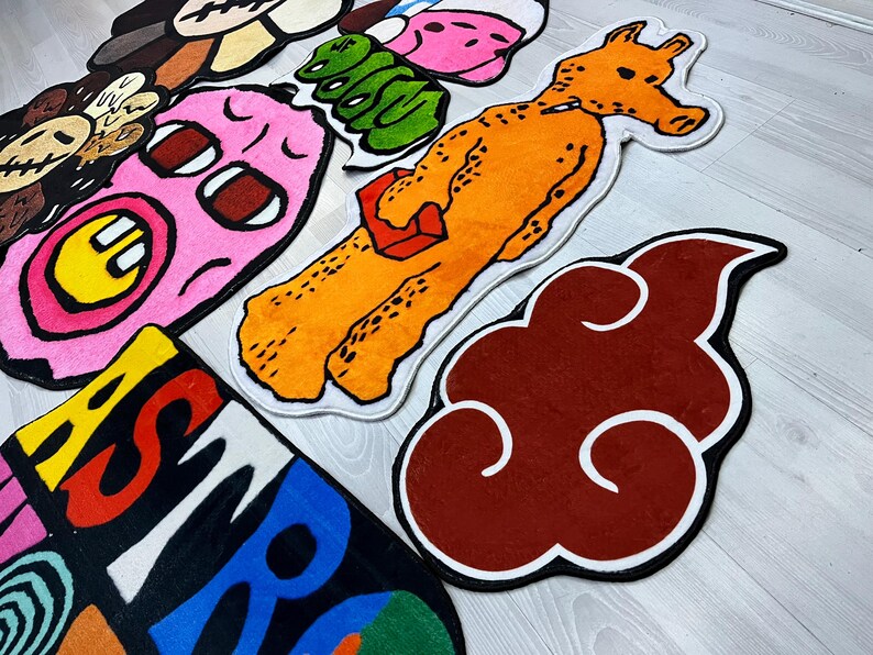May include: A set of colorful cartoon-style rugs featuring various characters and designs. The rugs are made of soft, plush material and are perfect for adding a playful touch to any room.
