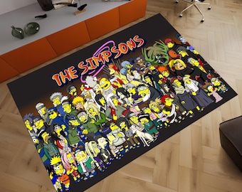 May include: A black and yellow rug with a cartoon image of the Simpsons characters dressed as ninjas. The rug has the text "The Simpsons" in a yellow circle with a pink outline.
