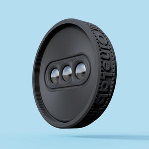 May include: A black, circular device with three reflective lenses and the text "oneLab" embossed on the side. The device has a textured edge and a series of concentric circles on its face. The background is a solid light blue.