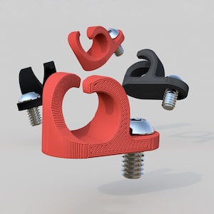May include: Four cable clips, two red and two black, with screw-on attachments. The clips are designed to hold cables in place.