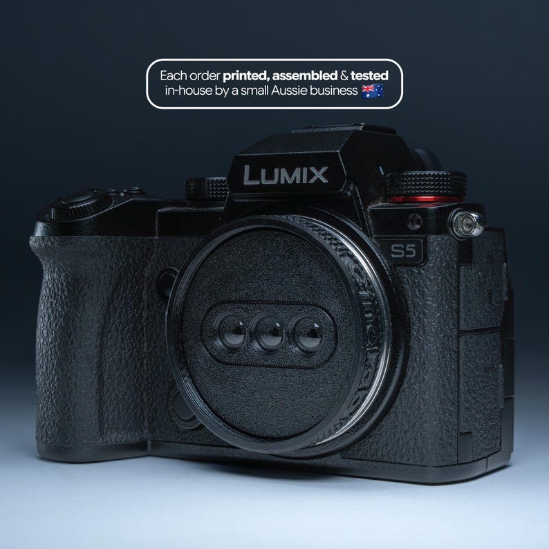 May include: A black Lumix S5 camera with a lens cap. The camera has the word "LUMIX" printed on the top. The text "Each order printed, assembled & tested in-house by a small Aussie business" is also visible.