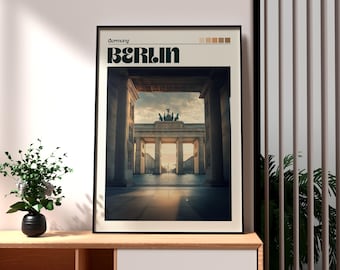 Può includere: Un poster incorniciato con una cornice nera e uno sfondo bianco. Il poster presenta una fotografia della Porta di Brandeburgo a Berlino, Germania. Il testo "Germany" e "BERLIN" è stampato in nero nella parte superiore del poster.