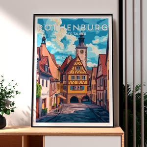 May include: A vintage travel poster featuring a colourful illustration of a street in Rothenburg ob der Tauber, Germany. The poster has a blue sky with white clouds and a tall clock tower in the background.