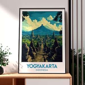 Peut inclure: Une affiche de voyage vintage représentant une illustration colorée d'une chaîne de montagnes et d'une série de temples à Yogyakarta, en Indonésie. L'affiche est dans un schéma de couleurs bleu et blanc avec le texte "YOGYAKARTA INDONÉSIE" en bas.