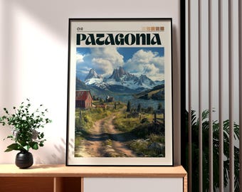 May include: Framed art print featuring a scenic landscape of Patagonia, Chile. The print displays a dirt road leading to a lake and mountains under a cloudy sky. The word "Patagonia" is printed in a bold font.