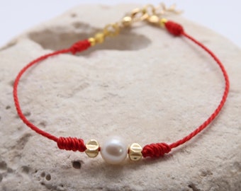 Minimalist bracelet with a freshwater cultured pearl and hematite. Red, dainty cord with lobster clasp. Handmade
