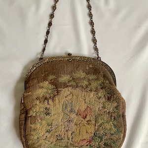 Antique Petit Point Silk Embroidered Evening Bag with Bucolic Scene of Man Courting Woman and a lovely brass floral chain and silk interior.