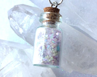 Glowing Dust of a Fairy from a Pixie Garden Glow in the dark Necklace