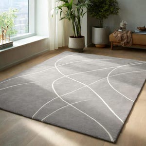 Tapis gris moderne avec lignes abstraites blanches, salon minimaliste, tapis décoratif
