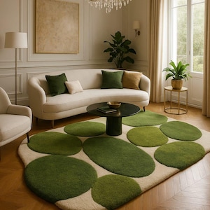 May include: A stylish living room with a cream sofa, green cushions, and a distinctive rug with green, organic shapes. The room includes a black coffee table, a chandelier, a floor lamp, and a large window with curtains. The rug's design adds a modern touch.