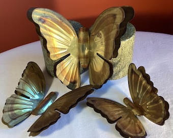 Three sizes of brass butterfly wall hangers with double layered wings. 5 inches, 4.25 and 3.50, in assorted colors of brass. Vintage and MCM