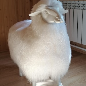 Sheep ottoman in Lalanne style. Large, made of natural Tibetan sheepskin fur, white.