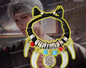 May include: A black cord bracelet with silver rings, red and blue beads, and white fang charms. The bracelet has a silver charm with a Celtic knot design.