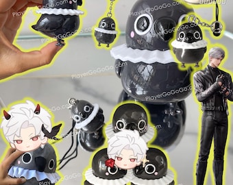 May include: A set of five black and white plush toys. The toys are shaped like birds with white ruffles around their necks. The toys are attached to keychains. The toys are on a white surface. The text "PlayerGoGoGo.com" is visible in the image.