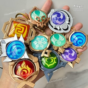 Luminoso Genshin Impact Vision Charm Ruota Lunare, Serpente a 7 Mutamenti, Natlan, Fontaine, Inazuma, Liyue, Mondstadt, Snezhnaya, Sumeru, Skirk immagine 2