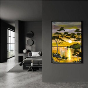 May include: A painting of a sunset over a lake with trees and a mountain in the background. The sky is a mix of orange, yellow, and purple. The water is a deep blue with reflections of the sunset.