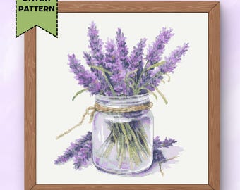 May include: A cross stitch pattern featuring a glass jar filled with lavender flowers. The jar is tied with twine and the flowers are a light purple color.