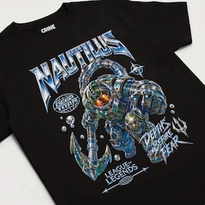 May include: A black t-shirt featuring a graphic of a metallic deep-sea diver holding an anchor. The text reads NAUTILUS, DEEP TITAN, DEPTHS BEFORE FEAR, and LEAGUE OF LEGENDS. The design includes bubbles and a trident icon in shades of blue and silver.