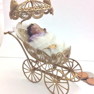 Porcelain Angel Baby by Sher Porcelain Nursery Tiny 2&quot; Doll in stroller With Birds and Crown of Swarovski Crystals, Baby of Color