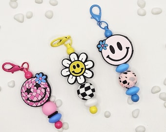 Ciondolo per borsa con faccina sorridente – Accessorio portachiavi