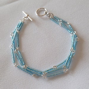 Light Blue Triple Strand Link Bracelet
