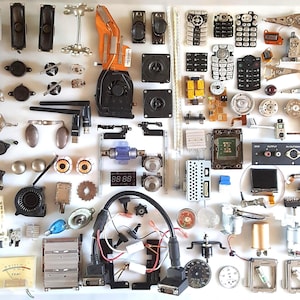 Lot of 110 salvaged vintage electronics parts for assemblage projects.